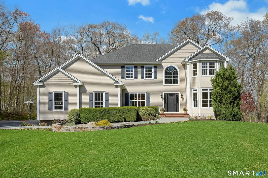 Pristine custom Colonial nestled on a peaceful and private 2.