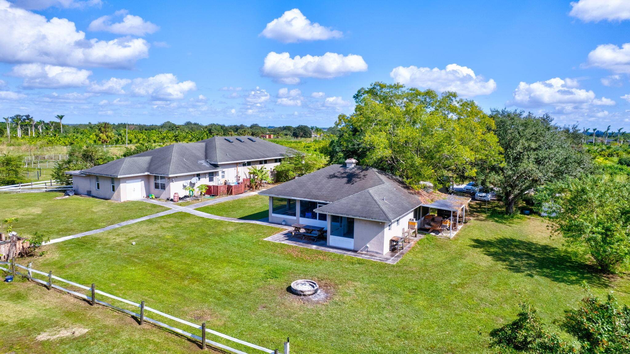 Amazing 9 Acre Equestrian Training Facility, Hurricane Rated Concrete Center Isle Barn 6 Stalls, European Stalls, Wash Rack, Fire Sprinklers, Fly System, Feed Tack ; Room, Laundry Room, Washer Dryer, ...