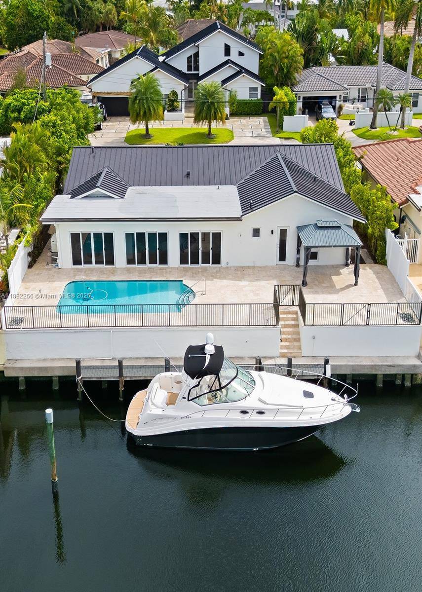 Experience waterfront living at its finest in this stunning 4 bedroom, 3 bath residence located in the exclusive Intracoastal community of Bermuda Riviera.