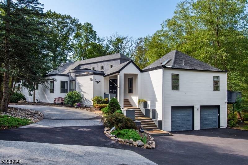 Prepare to be captivated by this stunning, beautifully updated contemporary estate nestled on a serene, private 3.