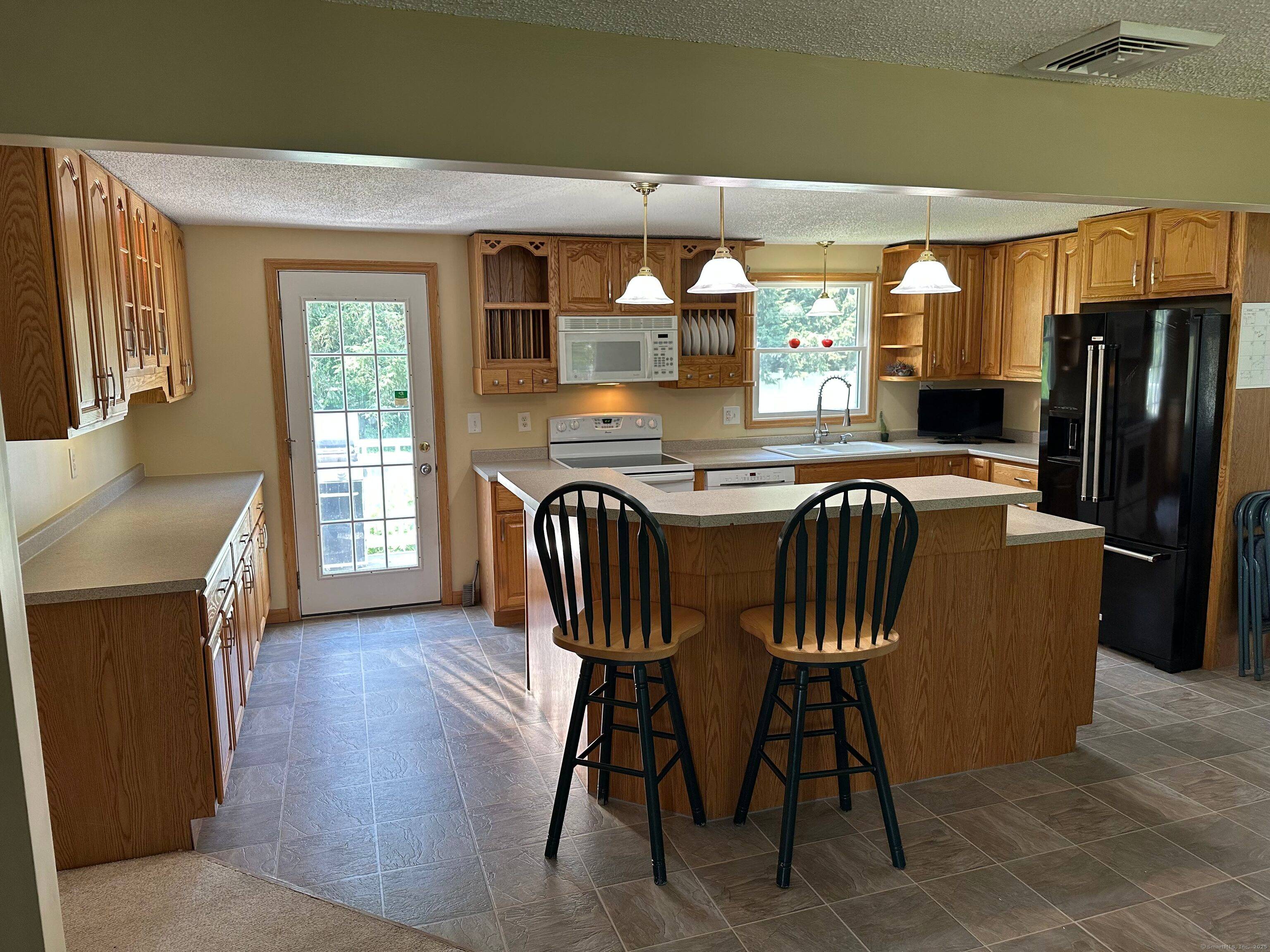 Welcome to 27 Margaret Dr in the charming Broad Brook area of East Windsor !