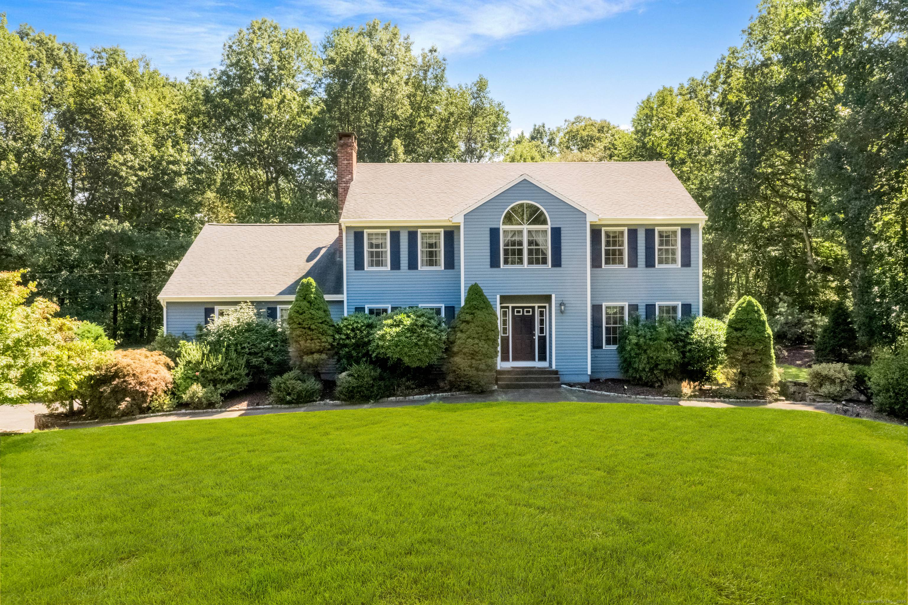 This custom built Colonial offers 4 bedrooms and 4 bathrooms, nestled on 3 serene, private acres with stunning pond views.
