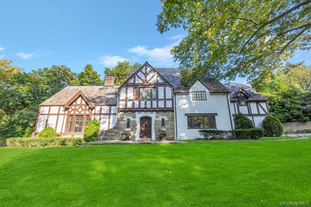 Located In Prestigious Great Neck Estates, This Impressive Colonial Exudes Historic Grandeur And Timeless Elegance.