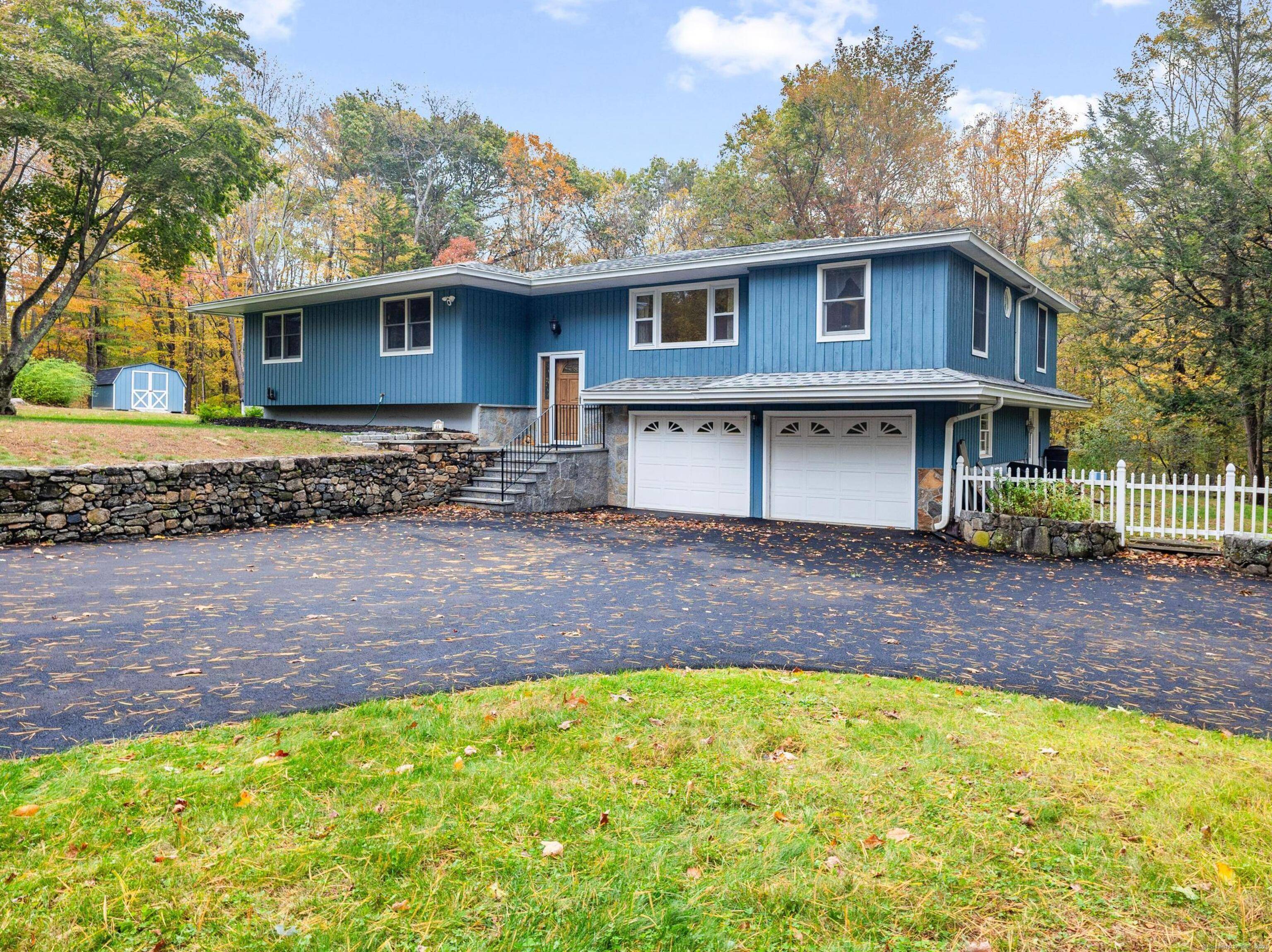 A private Brookfield retreat of style and serenity set on 2.