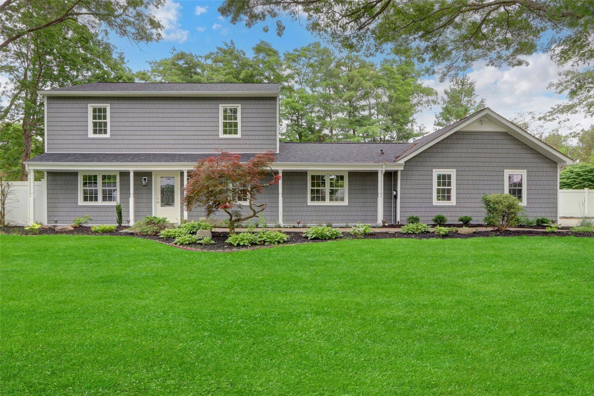 This beautifully renovated Colonial offers 4 spacious bedrooms and 2.