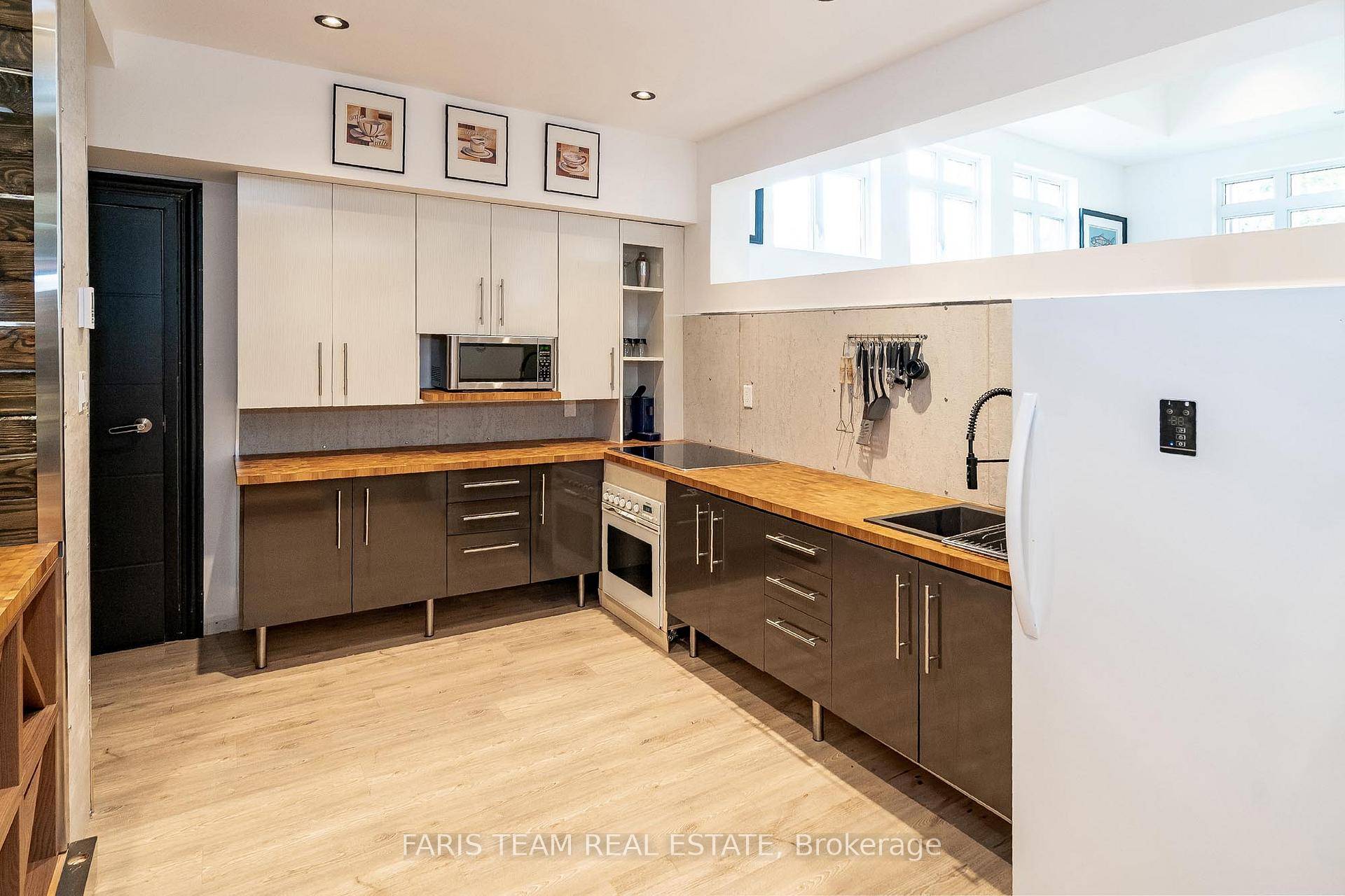 Top 5 Reasons You Will Love This Home 1 Custom built bungalow offering exceptional potential, boasting a luxurious 5 star rated 2 bedroom Airbnb on the lower level that generated ...