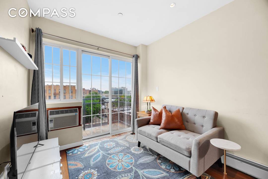 Top Floor 1BR Penthouse Condo with Balcony, Open Views amp ; In Unit Laundry in the Heart of Sunnyside Welcome to your private perch in the sky a sun drenched ...