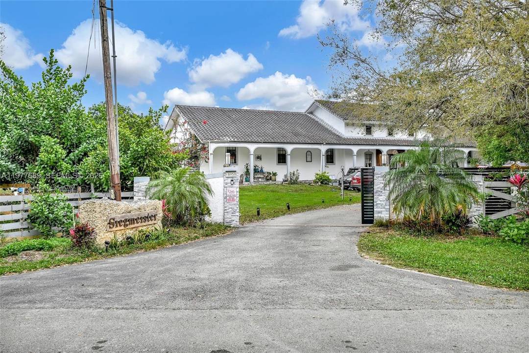 Set on over two landscaped acres in Southwest Ranches, this private estate offers space and privacy rarely found.