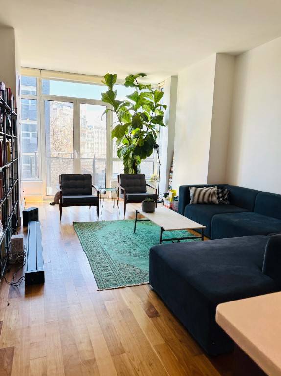 Bright and airy 1 bedroom in Williamsburg's Warehouse 11 condominium, featuring floor to ceiling windows, beautiful hardwoods, and a private outdoor space.