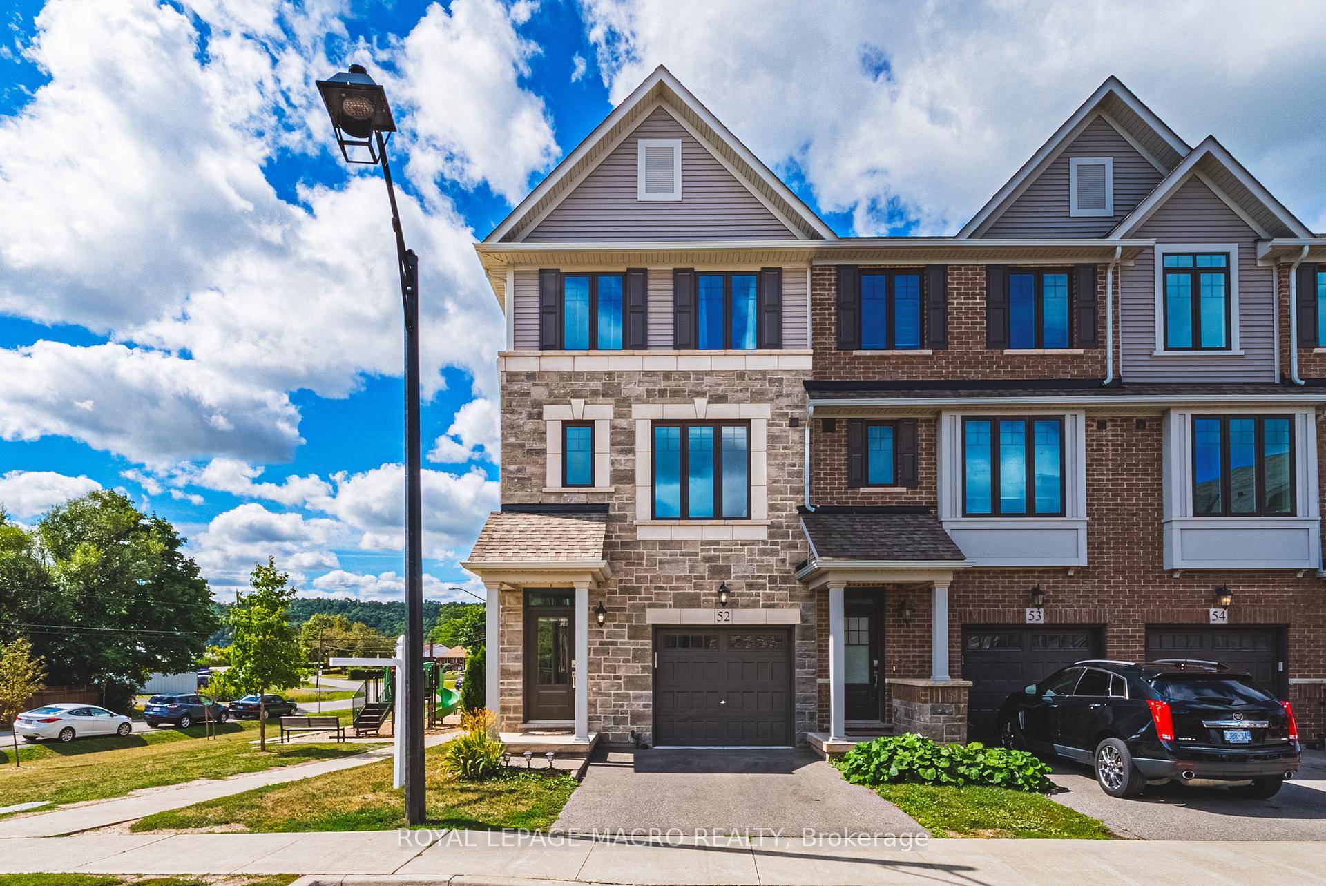 Welcome to this beautifully designed 3 storey corner lot townhouse that lives like a semi, offering 1, 730 sq.