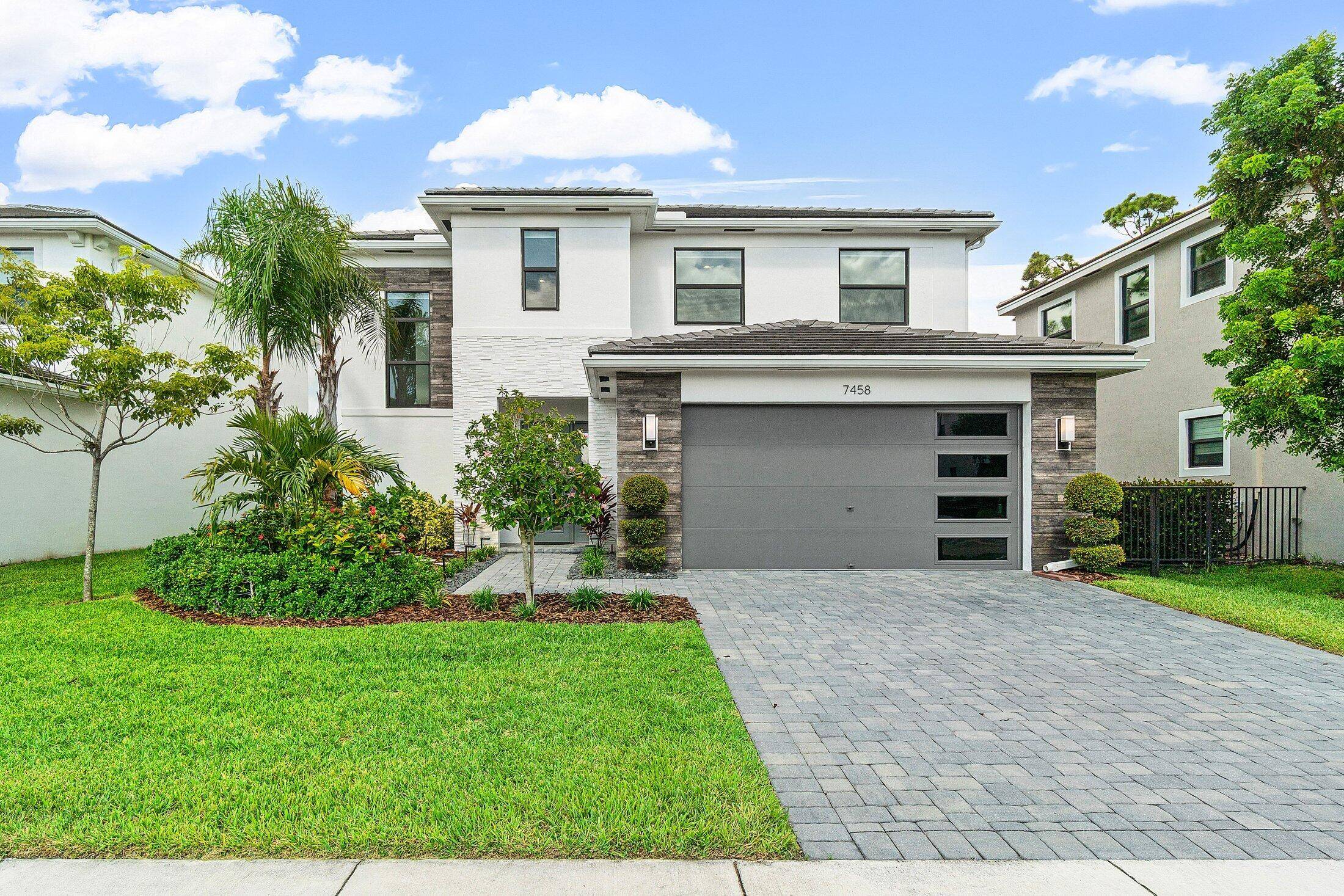 Welcome to 7458 Estero Drive, a beautifully maintained 4 bedroom, 3 bathroom two story home located in the desirable gated community of Toscana Isles in Lake Worth.
