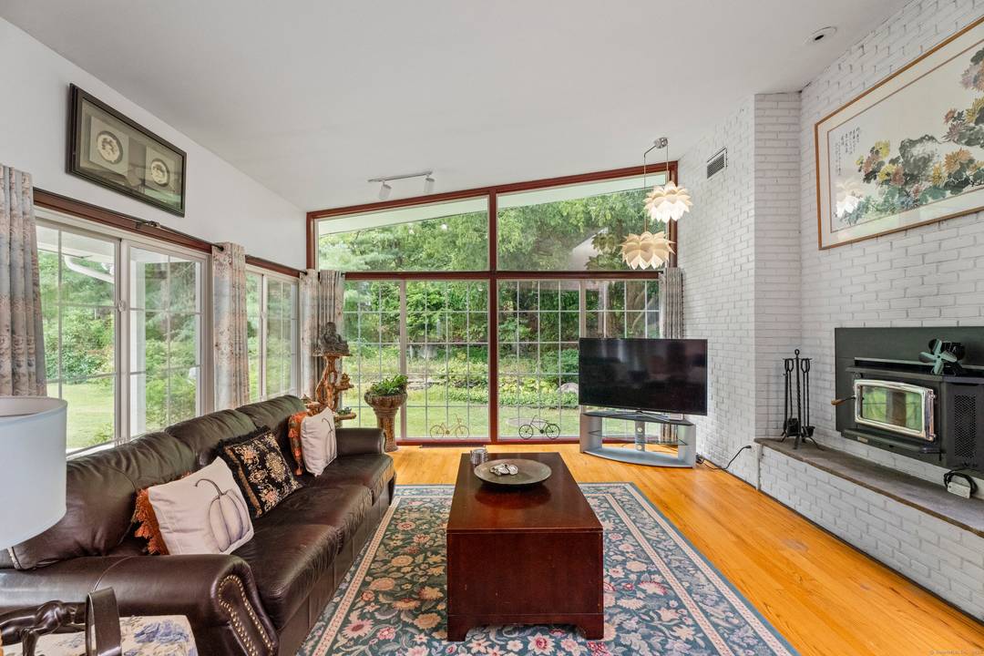 Contemporary comfort and natural beauty await at 46 Tumblebrook Rd !