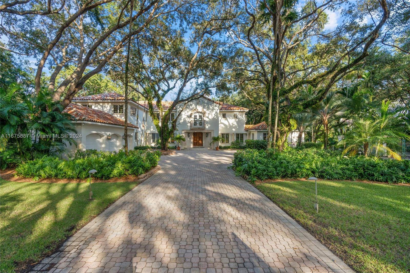 Vizcaya meets Fairchild at this enchanting 1 acre Old Cutler Rd estate.