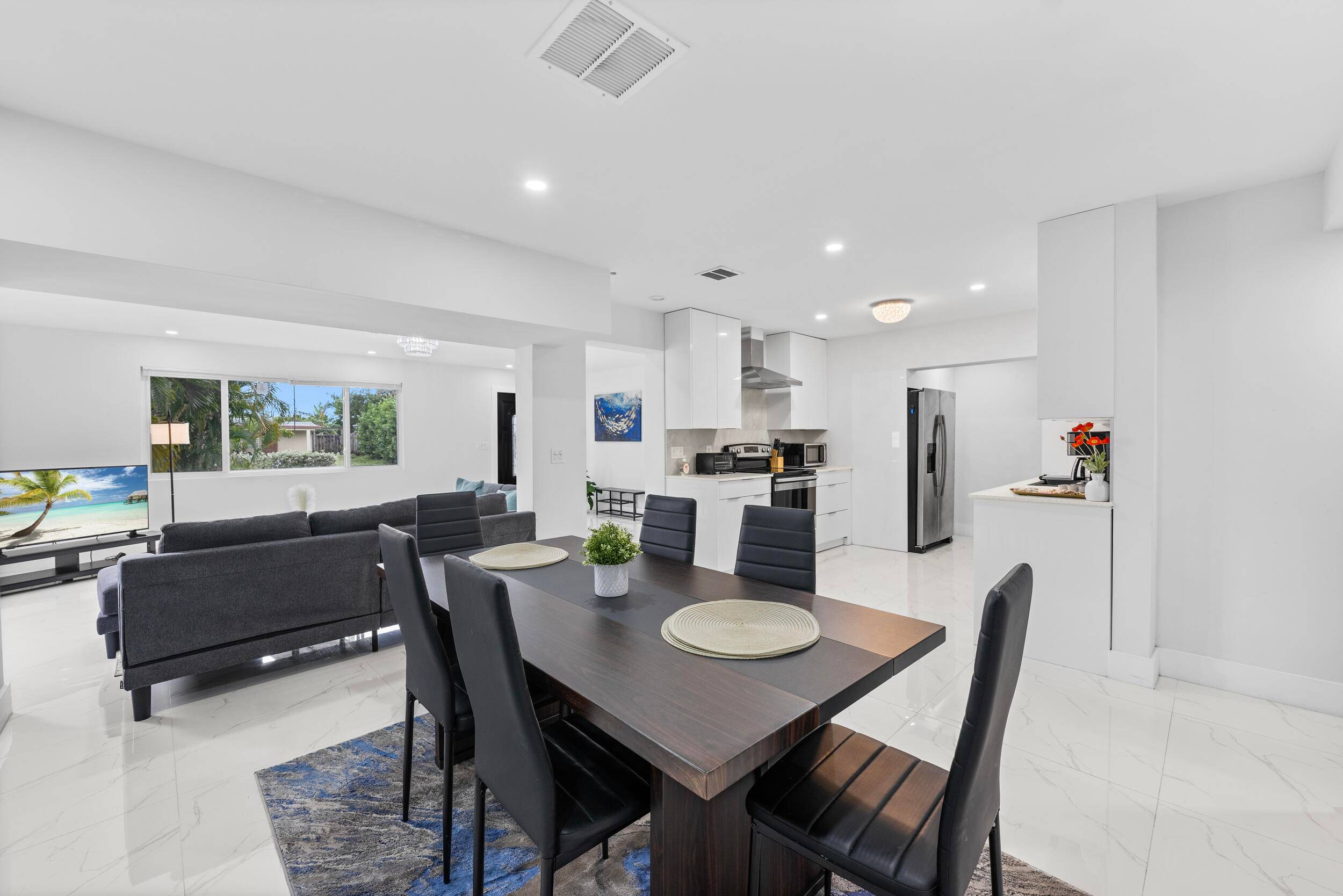Move in ready, modern, and affordable, this East Boca home is a fantastic opportunity perfect as a residence or a lucrative short term rental !