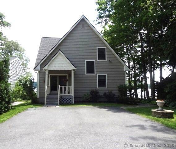 Bright and sunny Contemporary with open floor plan and natural light on Bantam Lake's quiet west shoreline.