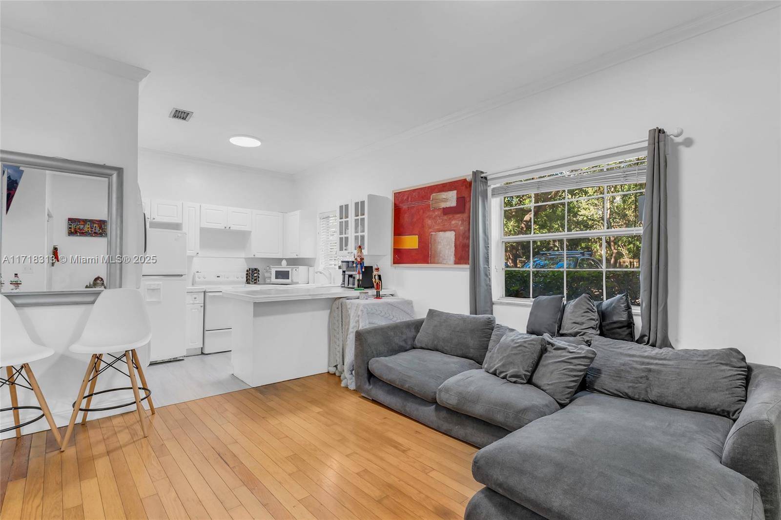 Rarely available 1 1 corner unit nestled in the heart of Coconut Grove.