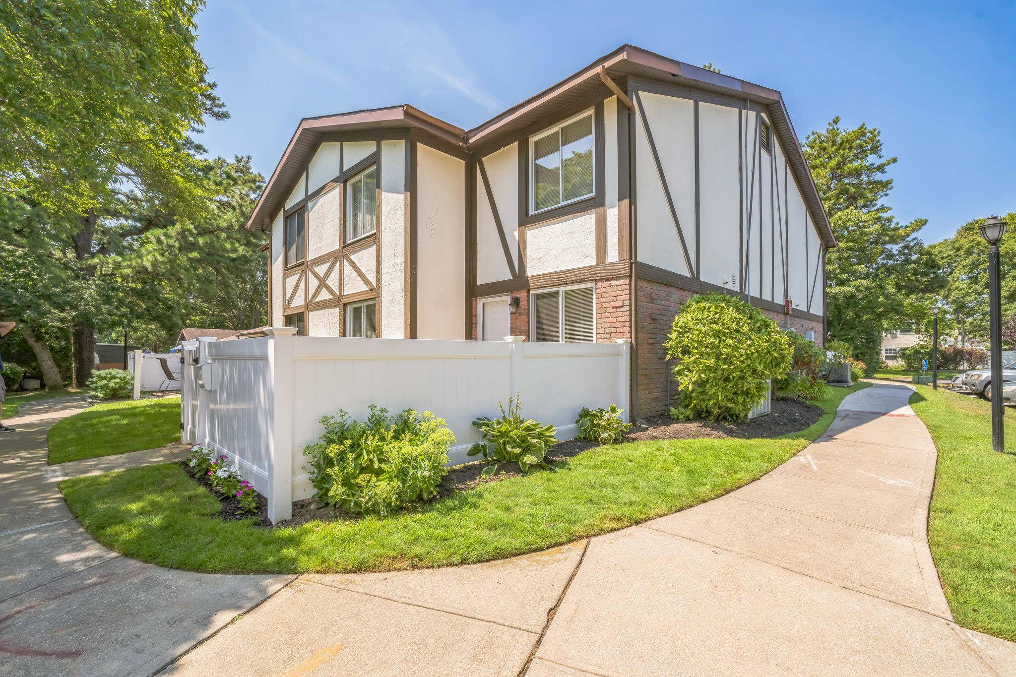 Two story end unit Condo Located in this highly desirable GATED community.