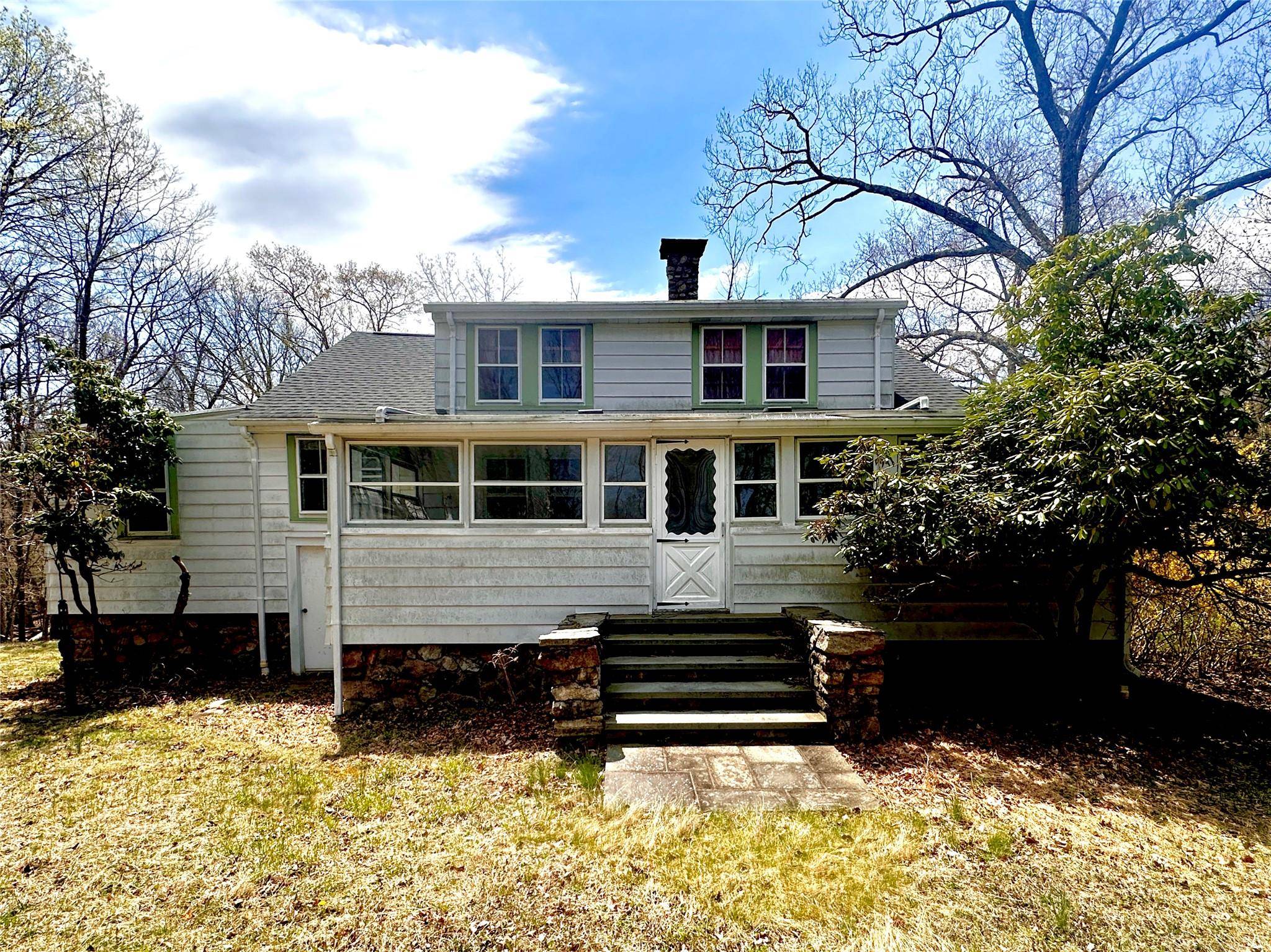 Beautifully crafted home with hardwood floors, stone fireplace, and original fixtures.