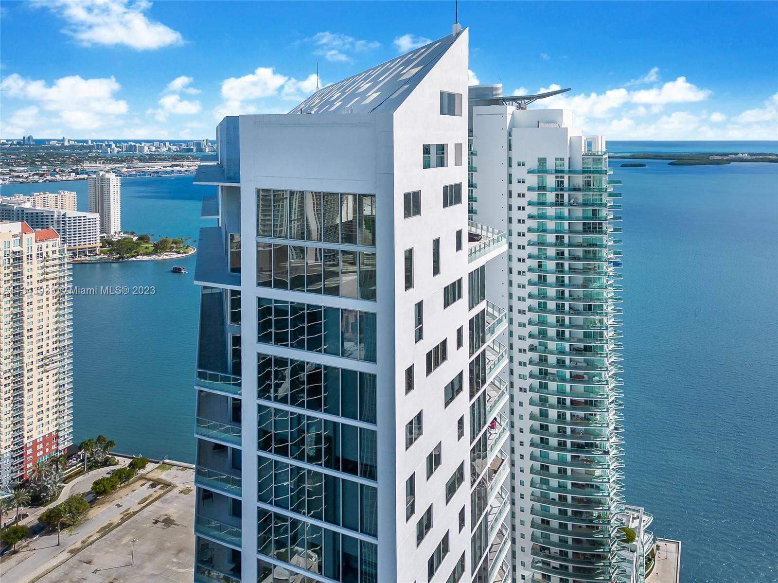 Style living in the prestigious Brickell House condo with beautiful bay view and within walking distance to Miami's Award Winning Restaurants !