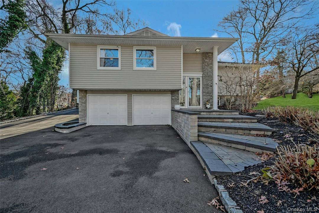 Welcome home to this impeccably maintained 3 bedroom, 2 bath Hi Ranch, perfectly situated on a desirable corner lot with low taxes of just 12, 049.