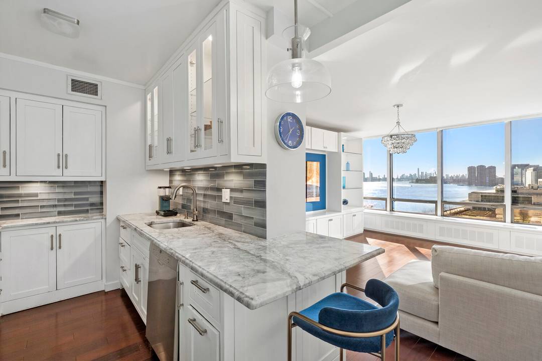 Beautifully renovated, south facing 2 bedroom residence with open East River and United Nations views through wall to wall windows.