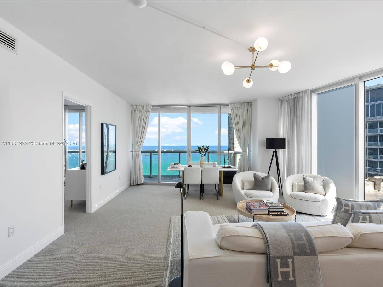 Impressive 55th floor corner residence at Icon Brickell offering panoramic views of Biscayne Bay and the Brickell skyline.