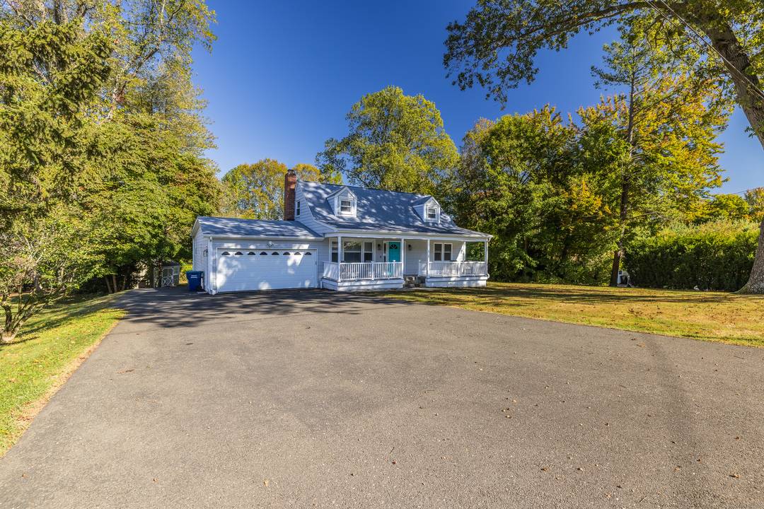 Welcome to 60 Lillian Drive a beautifully updated oversized Cape Cod that perfectly blends elegance, comfort, and family living.