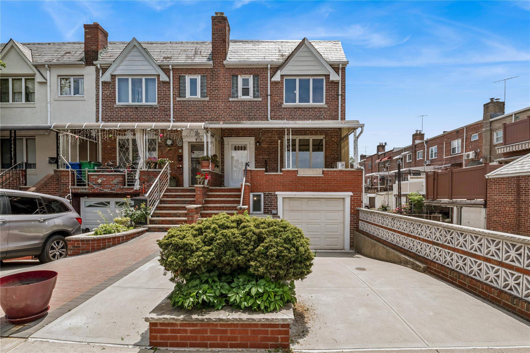 Coveted Middle Village corner side hall Colonial with driveway and one car garage with direct access to basement.