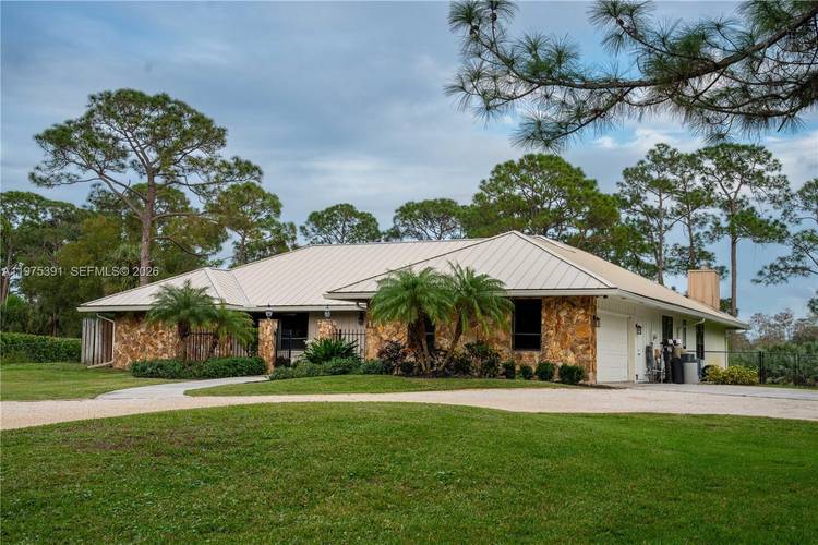 Welcome to 1872 SE Colony Way, the original model home of prestigious Ranch Colony and a rare opportunity to own a piece of the community s history.