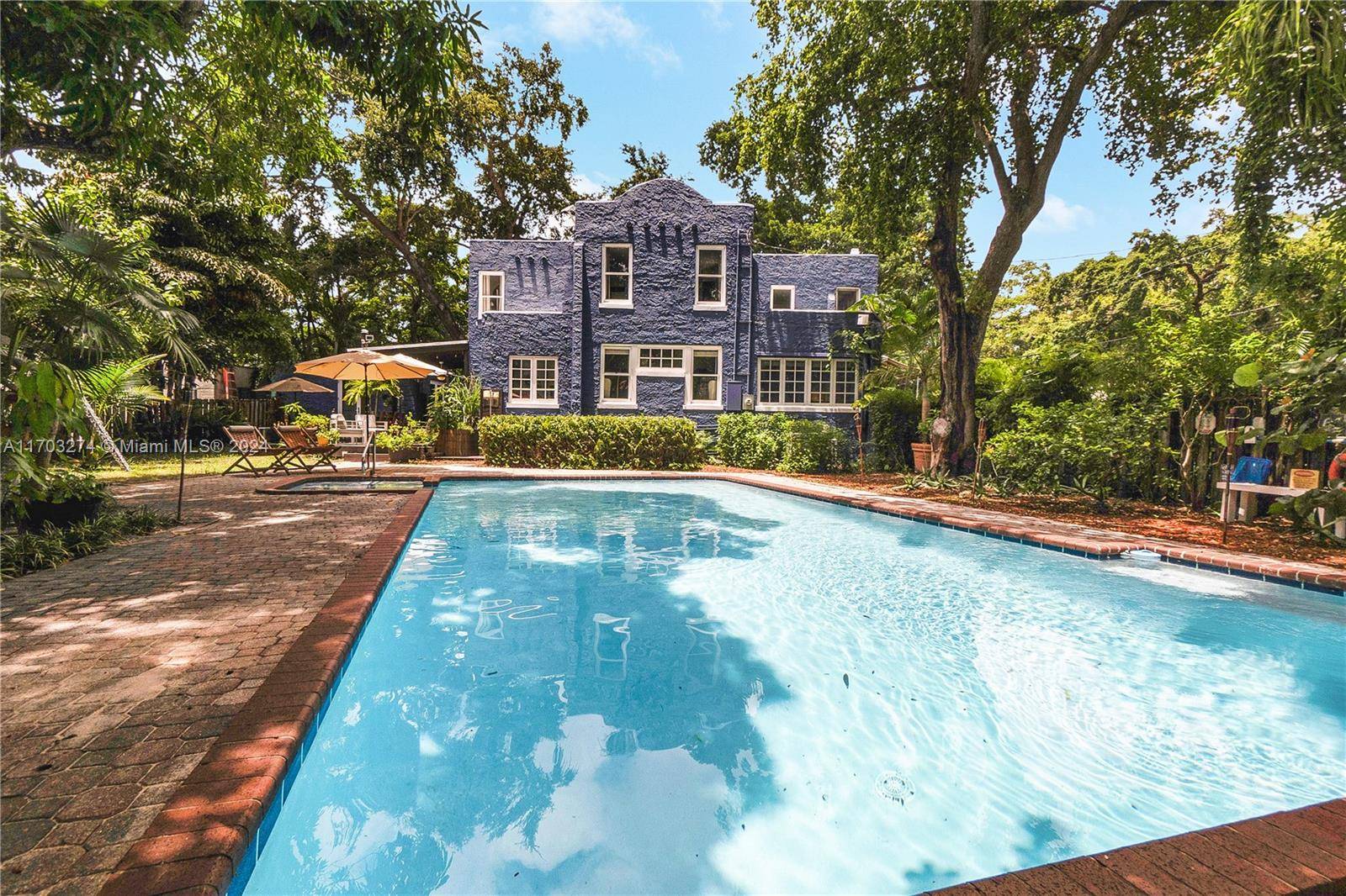 Welcome to Casa Azul, a 1926 Pueblo style historic home painted in a stunning Hudson Blue.