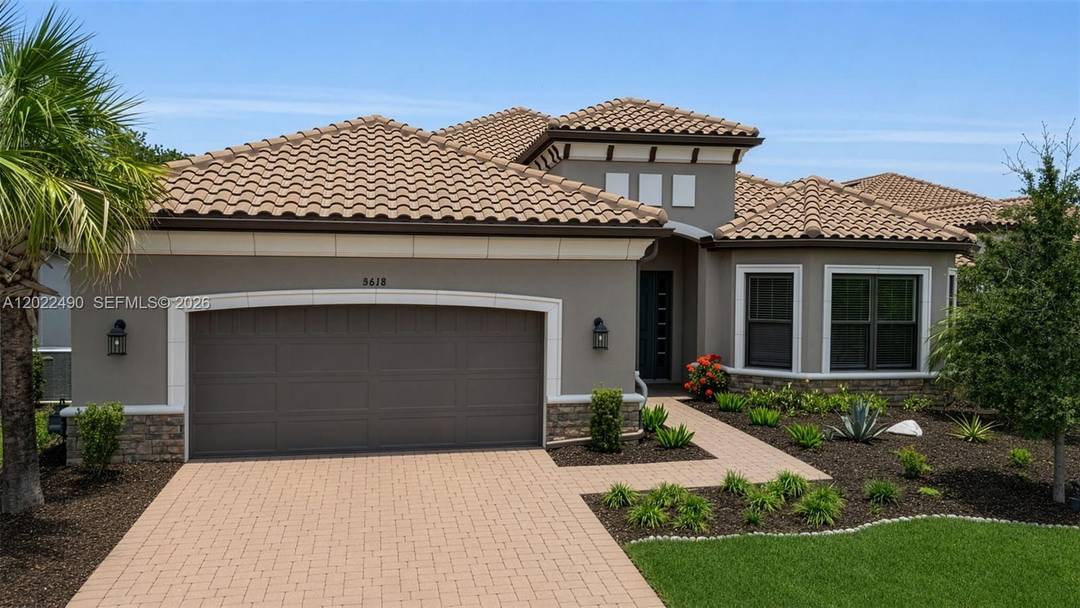 Welcome to resort style living in the highly sought after Esplanade at Artisan Lakes, located in Palmetto, Florida.