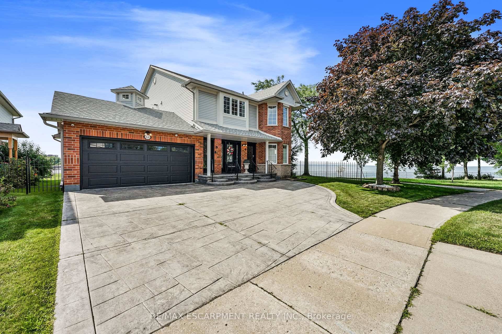 Welcome to 491 493 Dewitt Rd a truly one of a kind waterfront residence in Stoney Creeks sought after lakefront community.