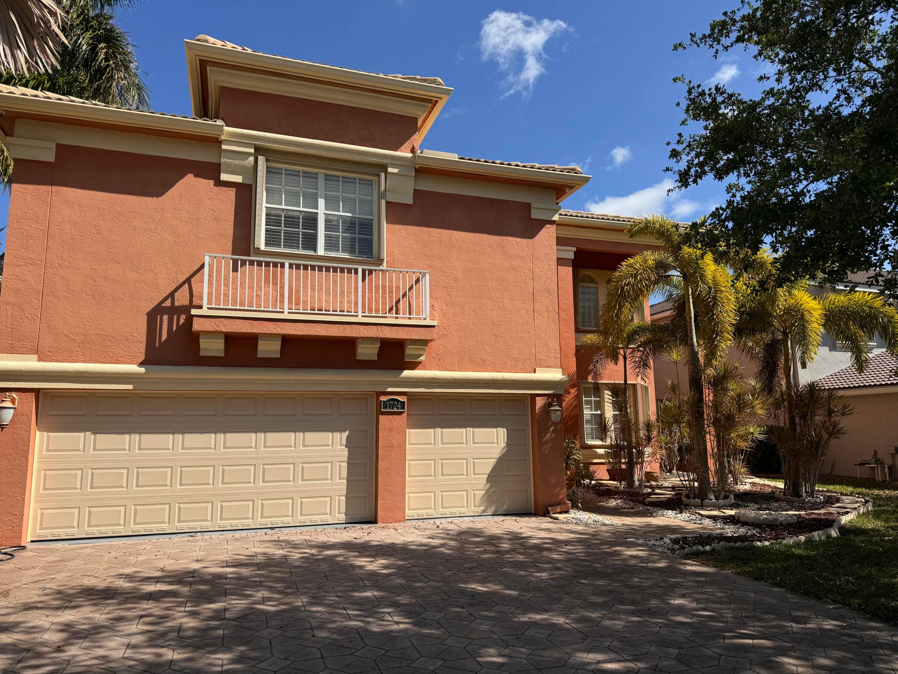 Stunning 6 bedroom, 4 bath lakefront home in the sought after Madison Green community of Royal Palm Beach.