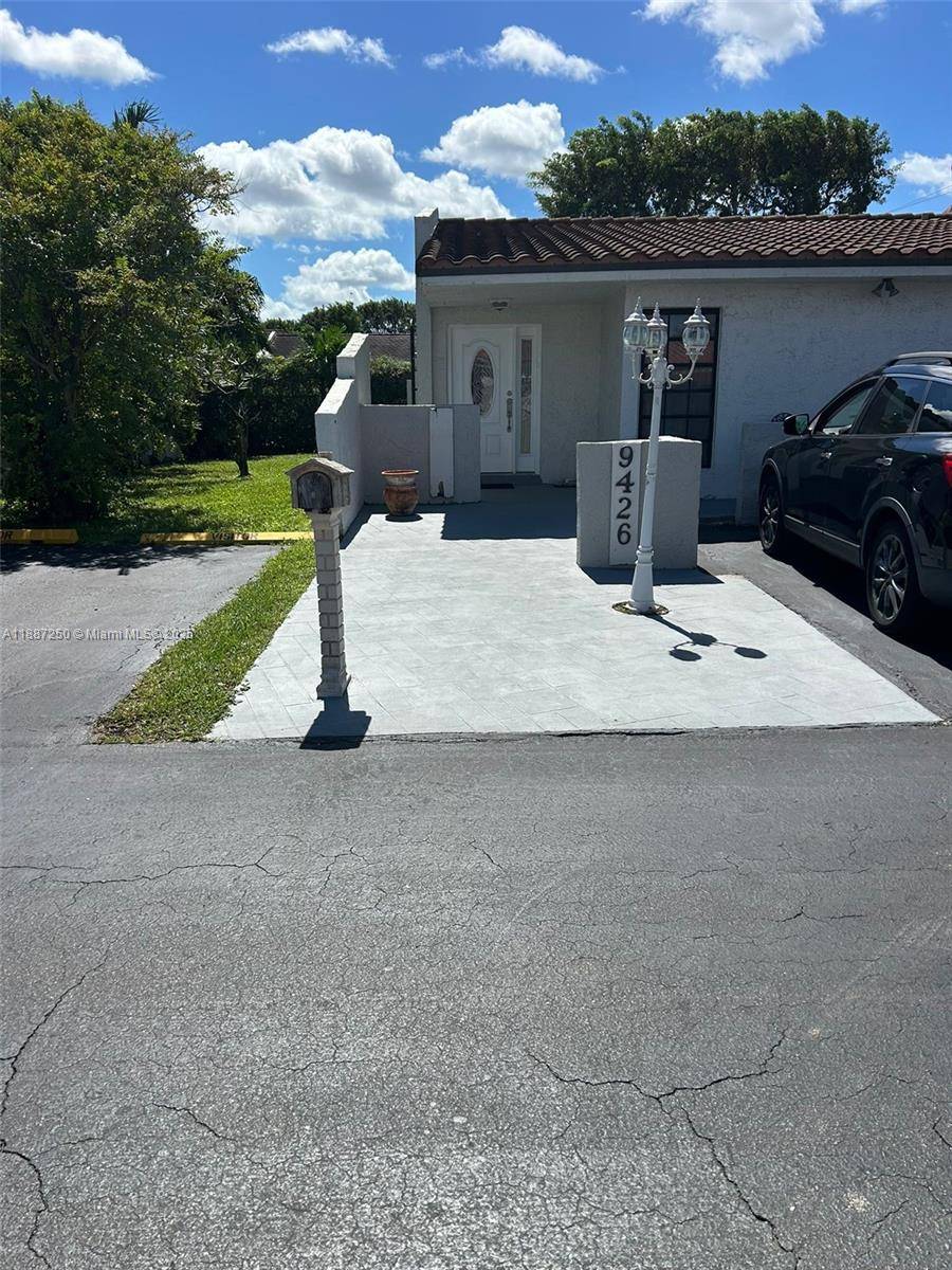 Welcome to this charming villa in the coveted Villas of Madeira community in Miami.