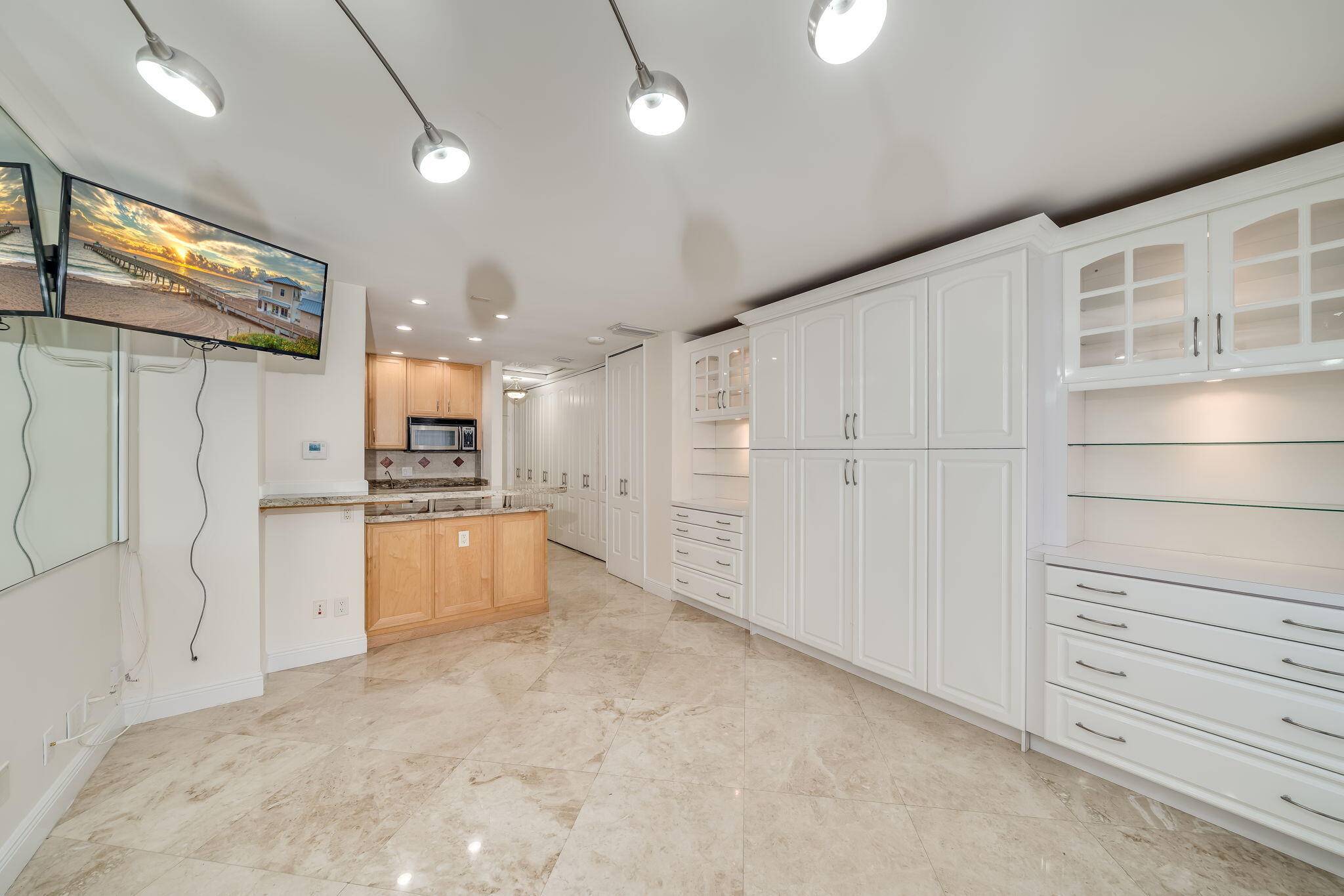 STEPS FROM THE OCEAN ! IMMACULATE STUDIO, LOWEST PRICED HOME IN BEAUTIFUL LOW HOA BUILDING, FEATURING MARBLE FLOORS, GORGEOUS REMODELED BATHROOM, PRETTY KITCHEN WITH LUXURY CABINETS, GRANITE COUNTERTOPS, STAINLESS STEEL ...