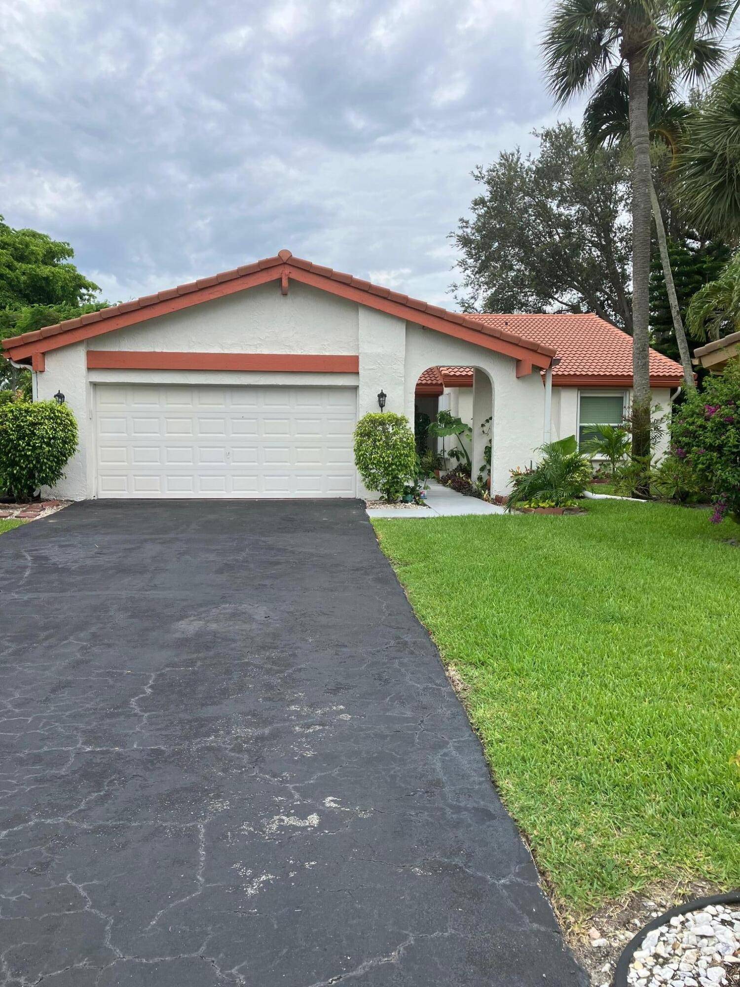 Beautifully renovated home with impact glass windows, new kitchen, new bathrooms, new flooring in the charming section of Indian Spring called ''THE MEWS''.