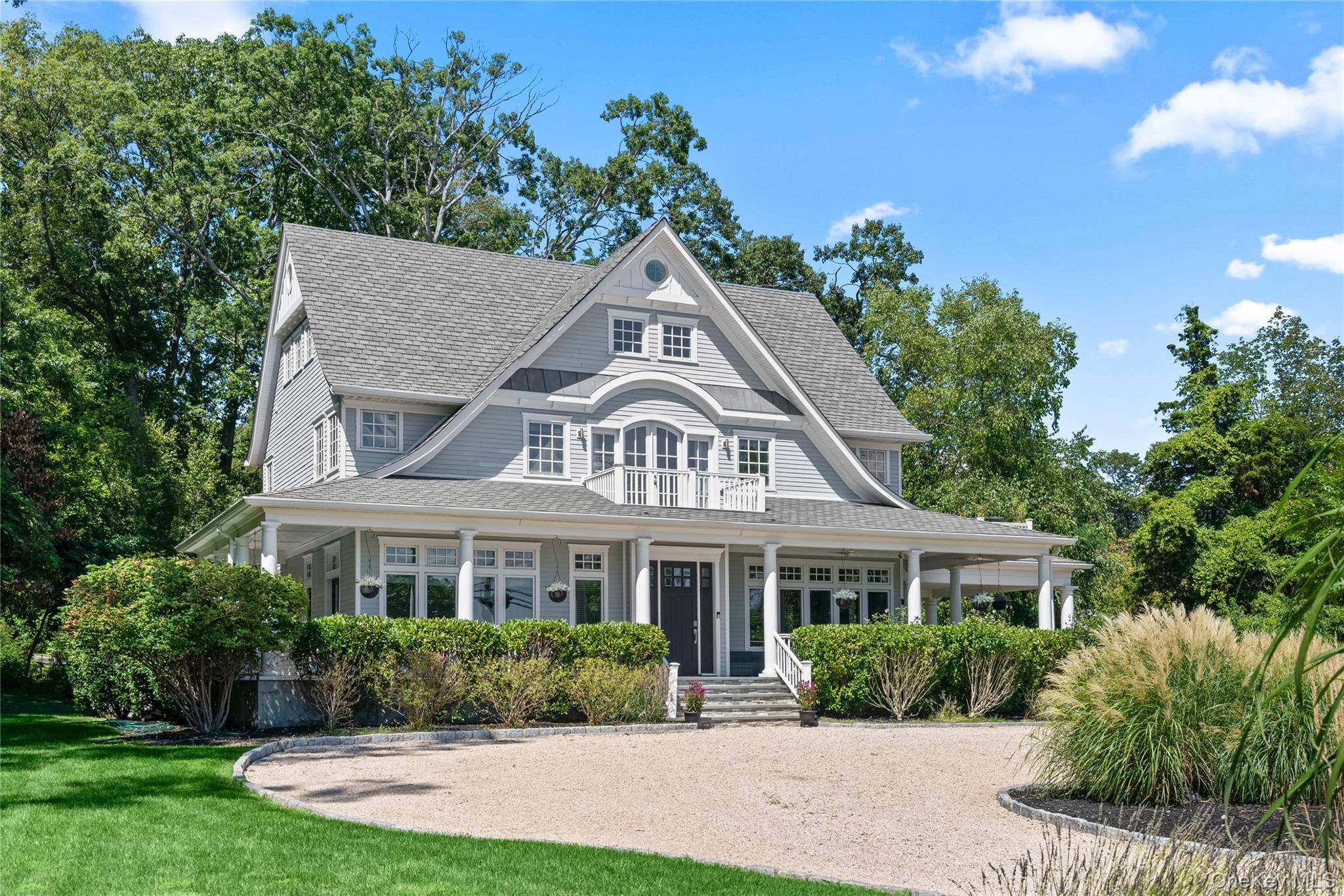 Enjoy spectacular 180 degree water views and timeless Hamptons style at Harbor Lights, a nine year old custom home perched on the shores of Lloyd Harbor.