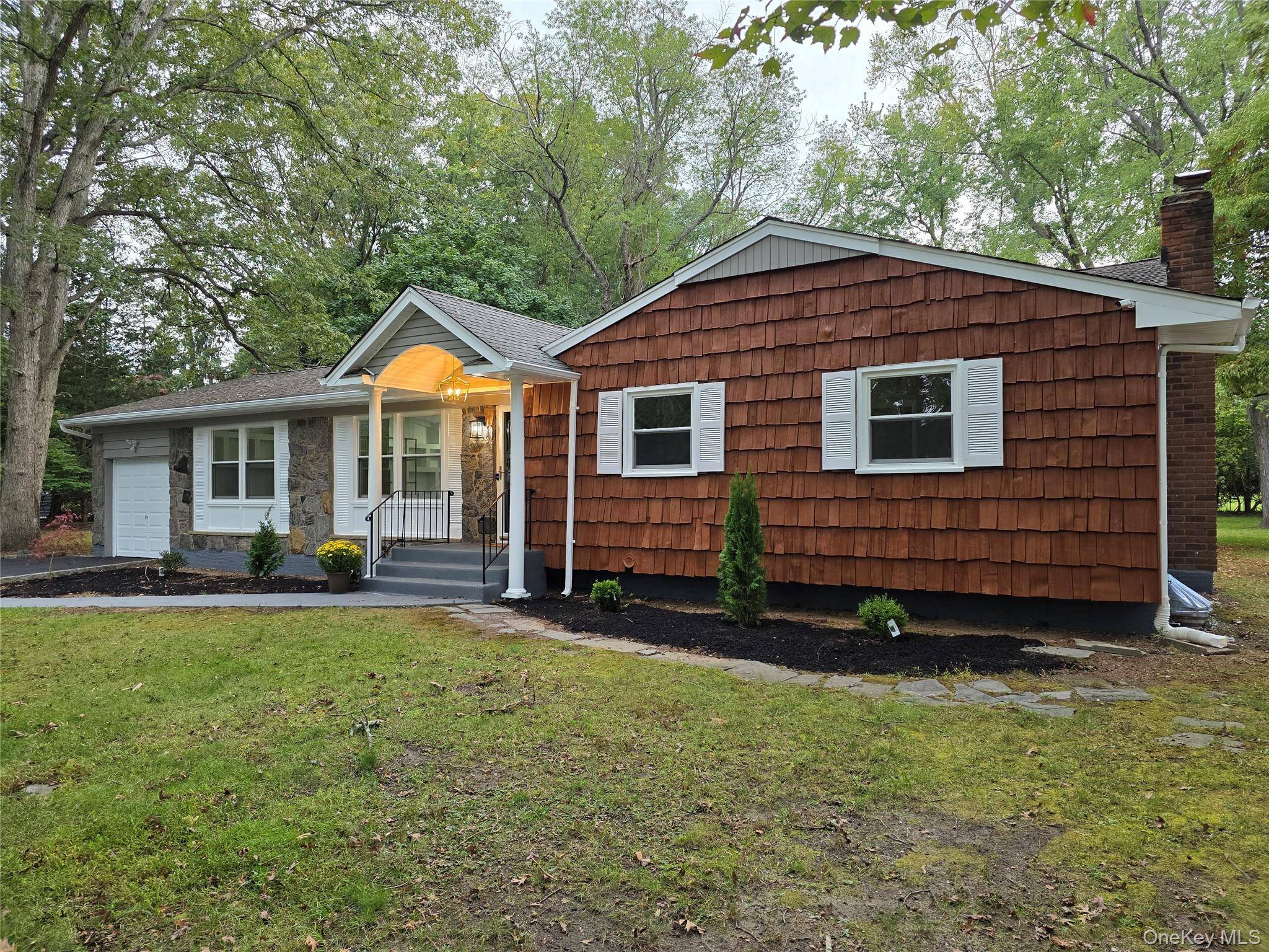 Welcome to a fully renovated masterpiece in Smithtown s Forestwood Park area, within the acclaimed Smithtown School District.
