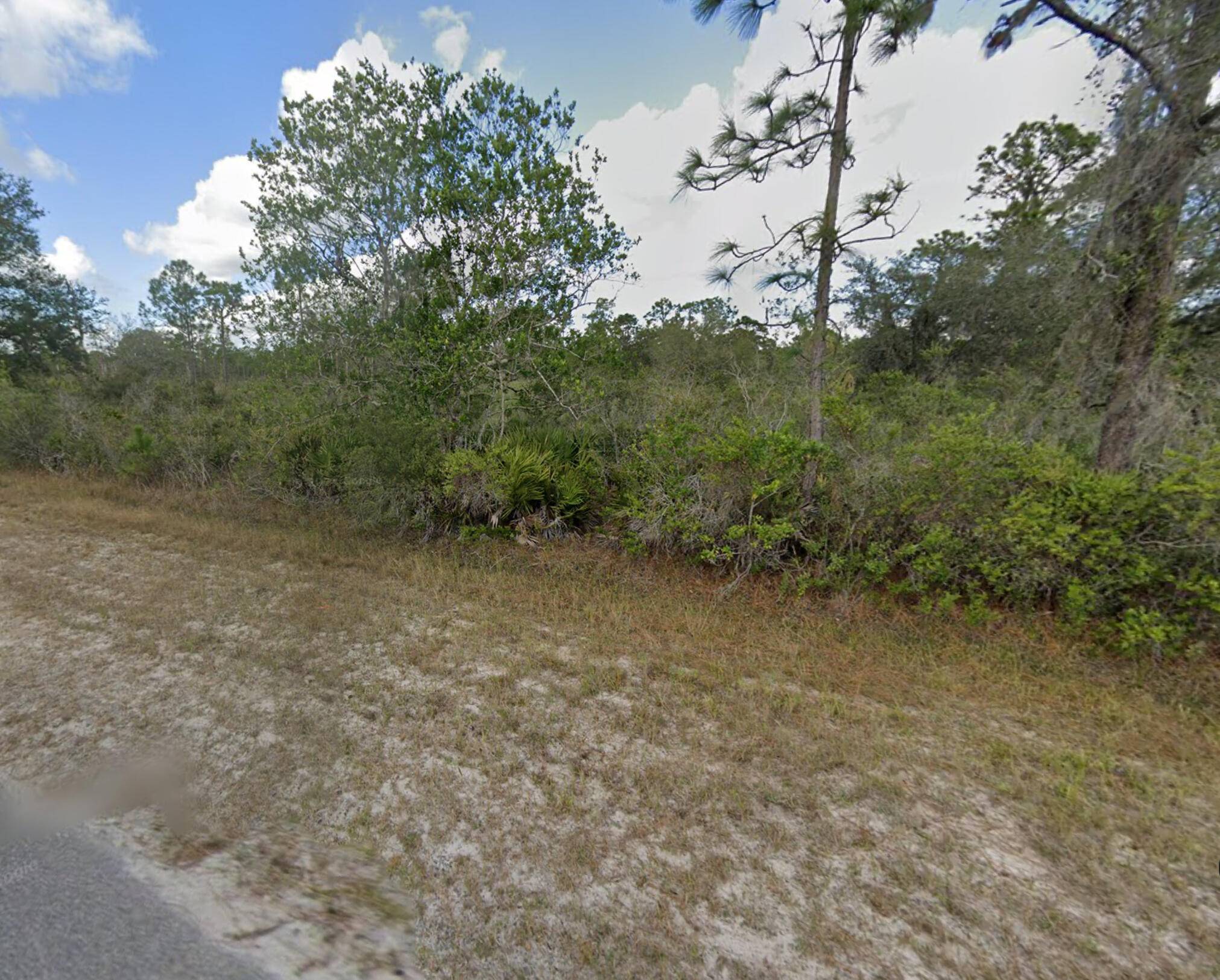 Discover the perfect canvas for your dream home in Indian Lakes Estates, FL on this half acre lot.