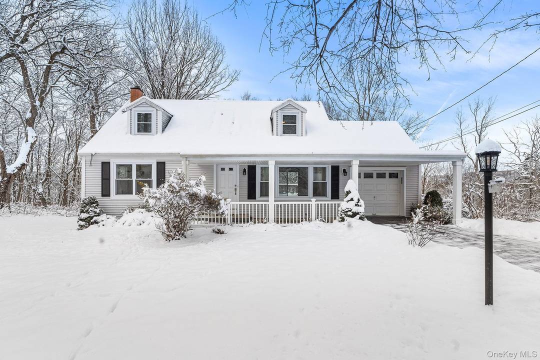 Nestled at the end of a private cul de sac, this home offers a peaceful setting with a backyard that borders wooded surroundings.