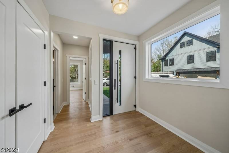 Welcome to Central Villas, a refined end unit townhome in the heart of New Providence, a seamless blend of modern design effortless living.