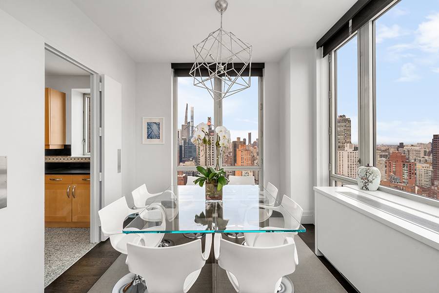 Impeccably Renovated Corner Residence with Panoramic Views !
