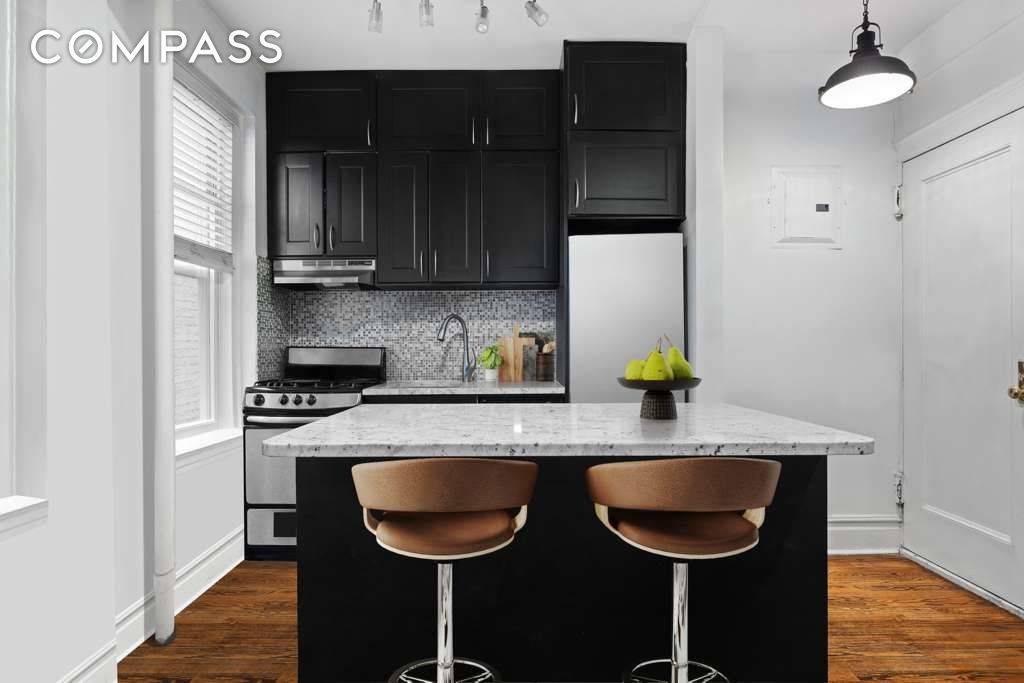 Welcome home to this sunlit top floor gem on a tree lined street in the heart of Turtle Bay.