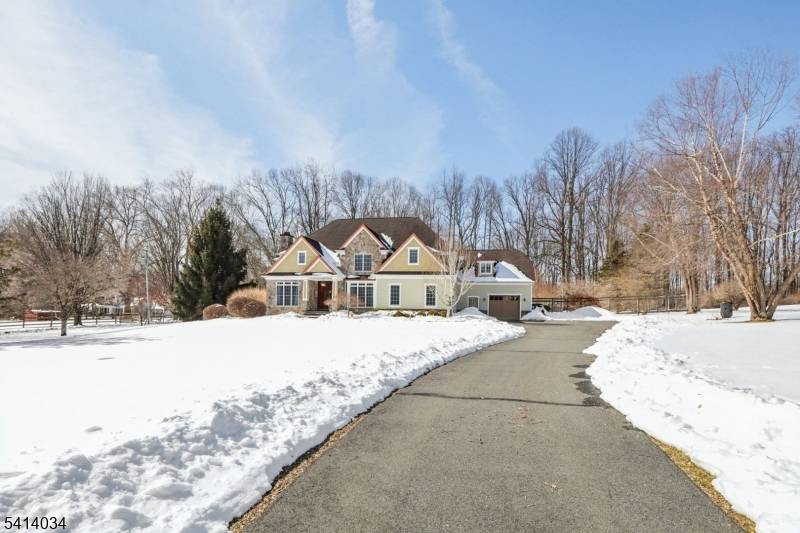 Welcome to this exceptional estate set on a private 2.