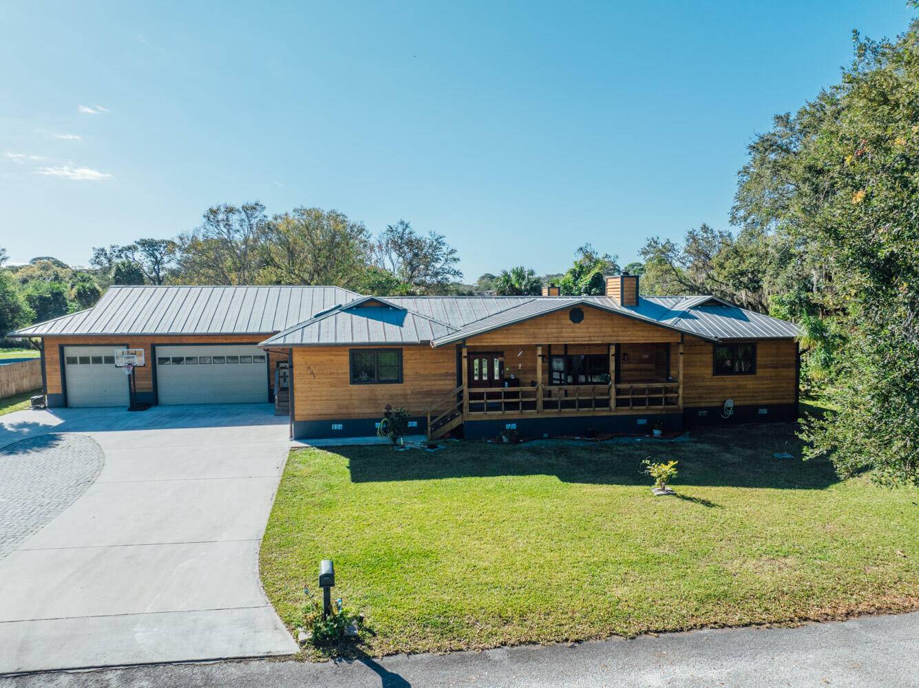 Discover your dream retreat in this beautifully designed elevated 3 bedroom 3 bath cedar clad home, offering 3, 058 sq.