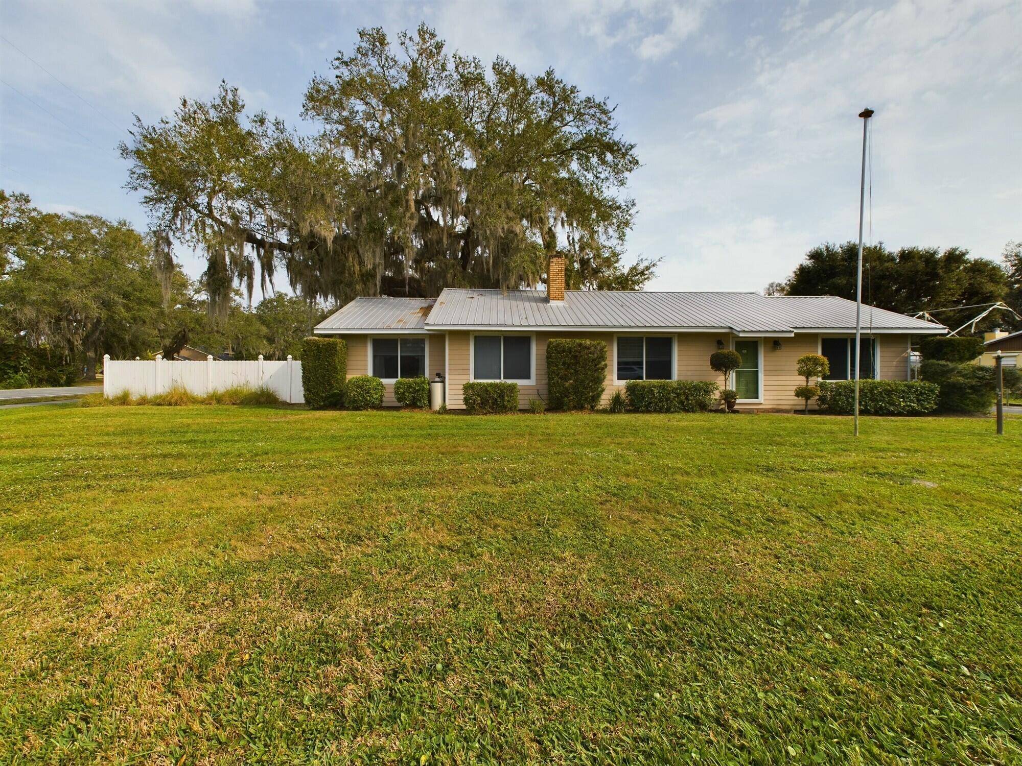 Discover this charming property at 1517 SW 5th Ave in Okeechobee, offering both a spacious main house and a versatile guest house.