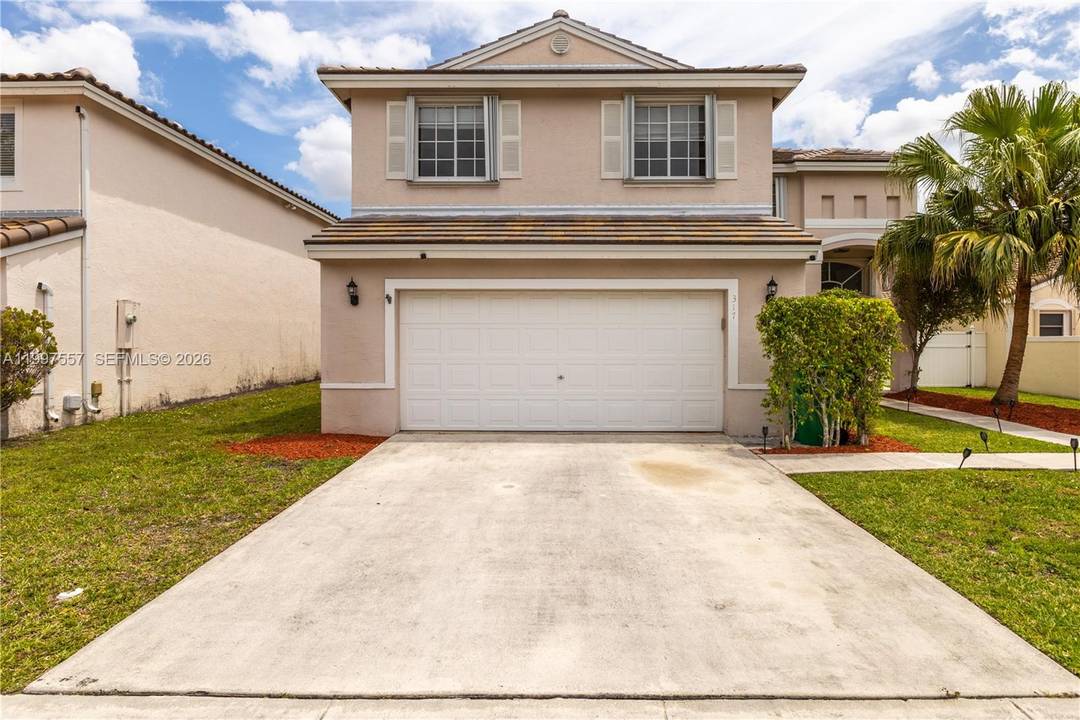 Beautifully maintained Pembroke Pines home located in a gated community.