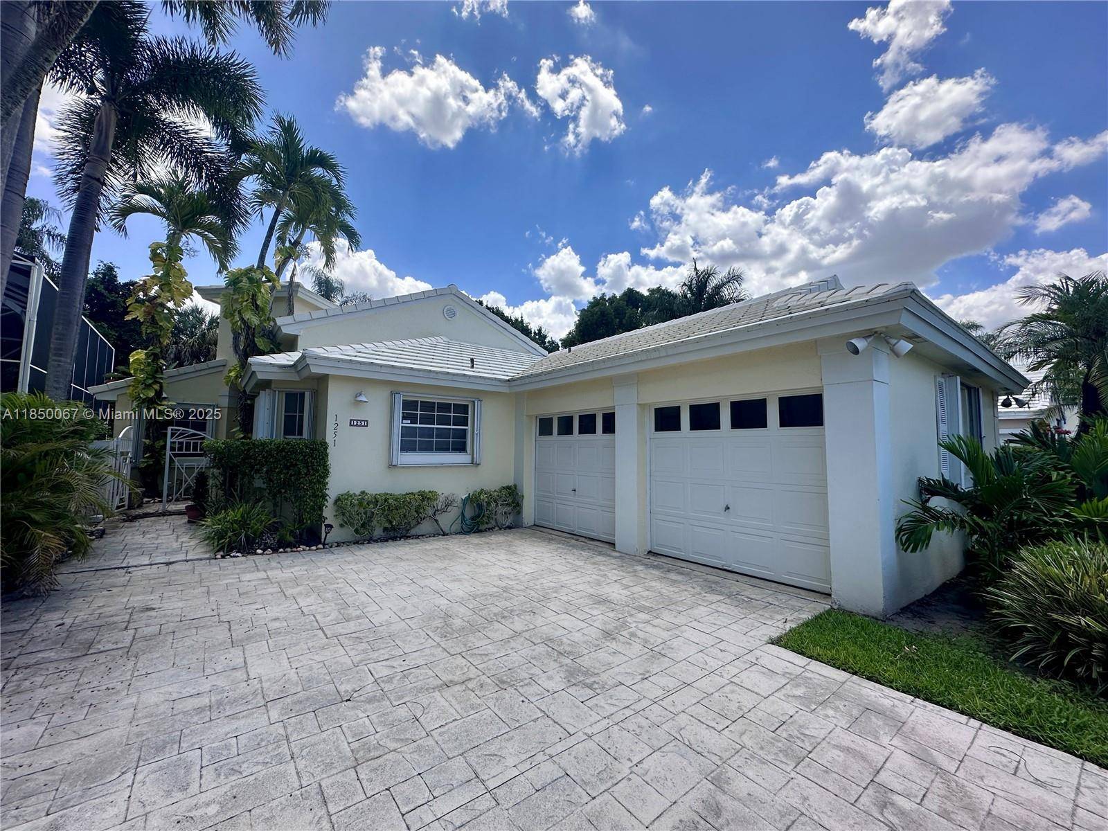This charming amp ; meticulously maintained home sits on a lush, palm lined street in one of Pembroke Pines most desirable neighborhoods.
