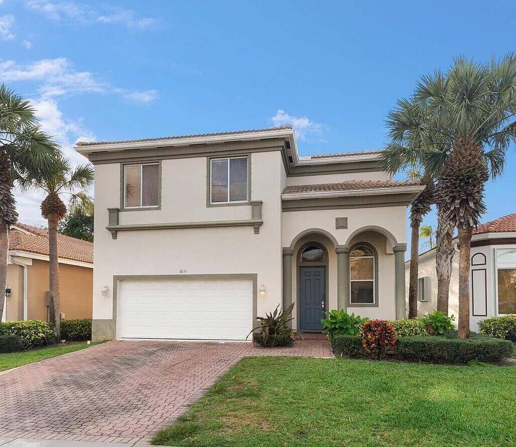 Welcome to 1033 Grove Park Circle, a spacious 6 bedroom, 3 bathroom home in the gated community of Palmyra Estates in Boynton Beach.