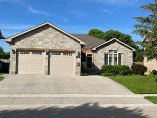 Amazing curb appeal, sought after detached stone bungalow, double car garage, 12 years old.